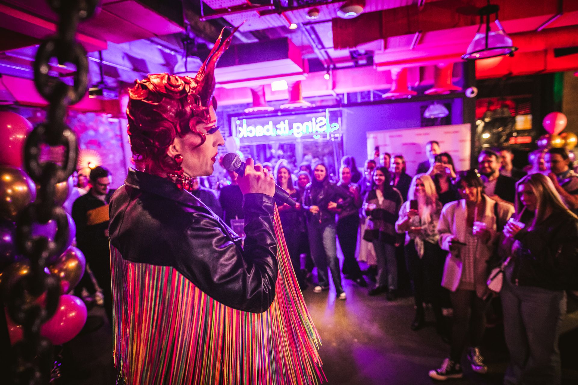 Drag queen doing karaoke